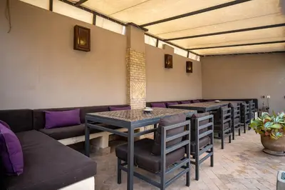 a row of tables and chairs in a room at Riad Vanilla Sma & Spa in Marrakech