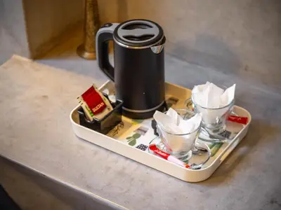 a tray with a coffee pot and cups on a counter at Riad Vanilla Sma & Spa in Marrakech
