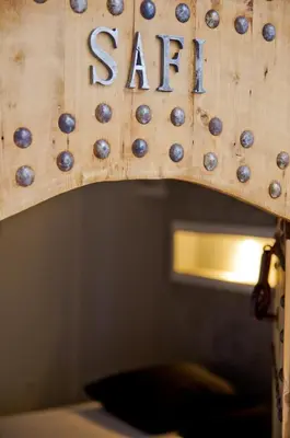 a wooden sign with the word safe written on it at Riad Kasbah 117 in Marrakech