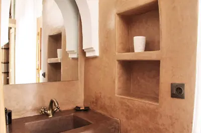 a bathroom with a sink and a mirror at Riad Miski in Marrakech