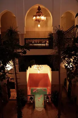 a room with a pool in the middle of a building at Riad Dar Jaguar in Marrakech