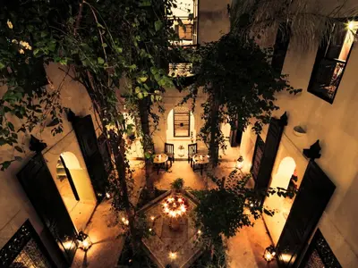 an overhead view of arium of a building with lights at Riad Dar Jaguar in Marrakech