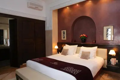 a bedroom with a large bed in a hotel room at Riad Monceau in Marrakech