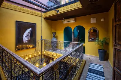 a room with a balcony with vases on the wall at Dar Khmissa Riad & Spa in Marrakech