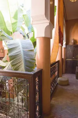 a stack of plates sitting on top of a table at Dar Attajmil in Marrakech