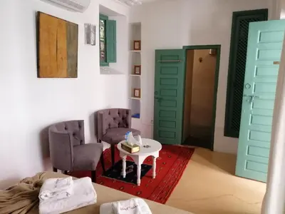 a room with two chairs and a table at Riad Swaka in Marrakech