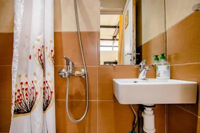 a bathroom with a sink and a shower curtain at Riad Medina in Marrakech