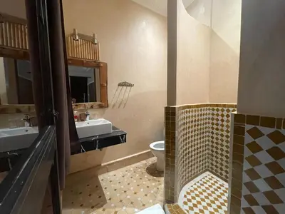 a bathroom with a sink and a toilet at Riad Samarine in Marrakech