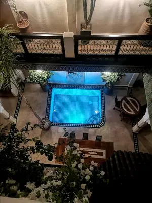 an overhead view of a swimming pool in a building at Riad Dalla Santa in Marrakech