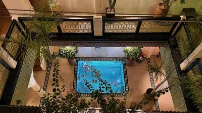 an overhead view of a swimming pool in a building at Riad Dalla Santa in Marrakech