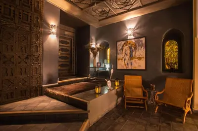 a living room with a couch and two chairs at Riad Hizad in Marrakech