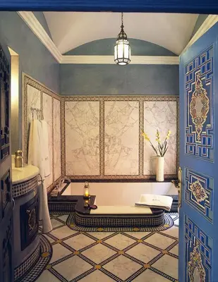 a bathroom with a tub and a sink in a room at Riyad Al Moussika in Marrakech