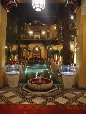 a pool in the middle of a hotel lobby at Riyad Al Moussika in Marrakech