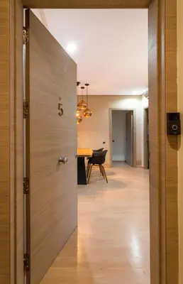 an open door leading to a dining room with a table at Darkech Prestigia Luxury Apt in Marrakech