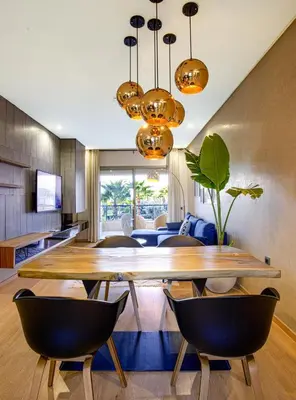 a dining room with a large wooden table and chairs at Darkech Prestigia Luxury Apt in Marrakech