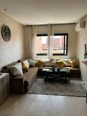 a living room with a couch and a window at Susana home in Marrakech