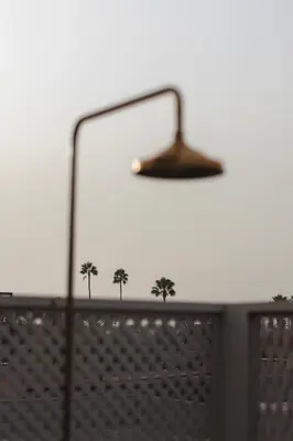 a lamp on top of a table with trees on it at Riad M17 - Hammam & Spa in Marrakech