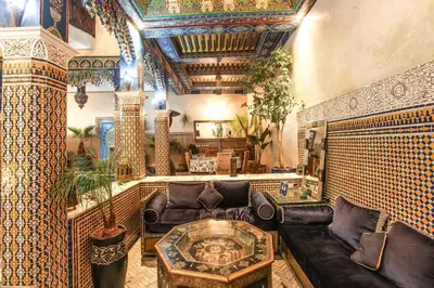 a living room with a couch and a table at Riad Puchka in Marrakech