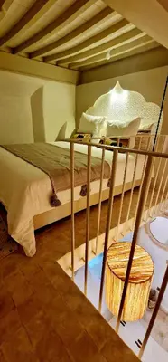a bedroom with a bunk bed with a wooden at Riad de Vincent in Marrakech