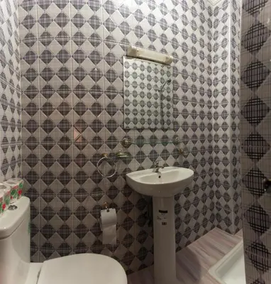 a bathroom with a sink and a toilet at Riad Omar in Marrakech