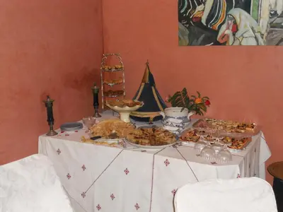 a table with a buffet of food on it at Riad Morgane in Marrakech