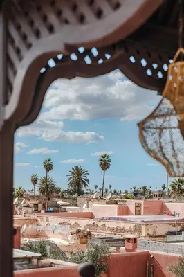 a view of a desert with palm trees in the background at Dar Beija in Marrakech
