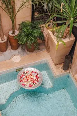 a pizza with candy canes and other toppings in a pool at Dar Beija in Marrakech