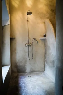 a shower stall in a bathroom with a shower at Riad Wabisabi in Marrakech