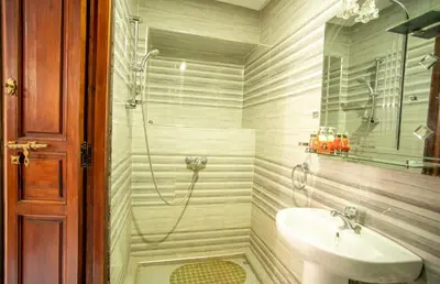 a bathroom with a shower and a sink at Riad Aymane in Marrakech