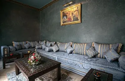 a living room with a couch and a table at RIAD DREAMS in Marrakech
