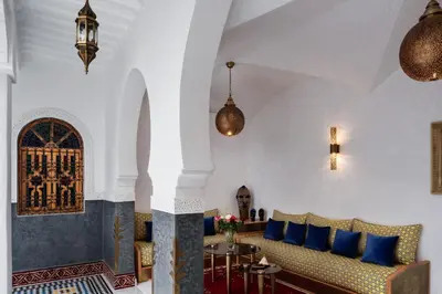 a living room with a couch and a table at Emma's Riad in Marrakech