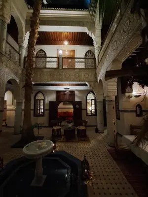 a large building with a large room with at Dar Al Kounouz in Marrakech