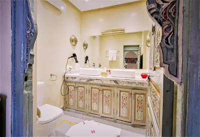 a bathroom with a sink and a toilet at Riad Tahyra in Marrakech