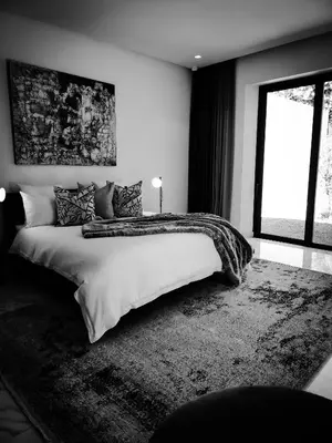 a bedroom with a large bed and a window at Villa Oxygène Marrakech in Marrakech