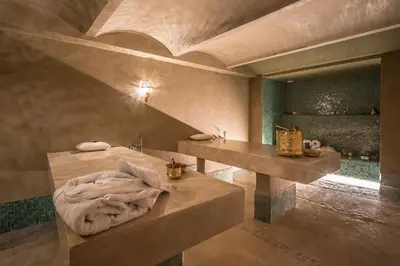 a room with a bed and a vanity and a mirror at BnB MEDINA in Marrakech