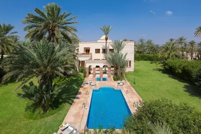 an aerial view of a house with a swimming pool at Domaine Rosaroum in Marrakech
