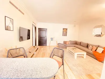 a living room with a couch and a table at Cosy stays central apartements , guéliz Marrakech in Marrakech