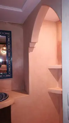 a bathroom with a sink and a mirror at Riad Achwaq in Marrakech