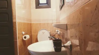 a bathroom with a sink and a toilet in it at Riad Ansar in Marrakech