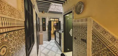 a hallway of a house with a tiled wall at Be Nomad in Marrakech