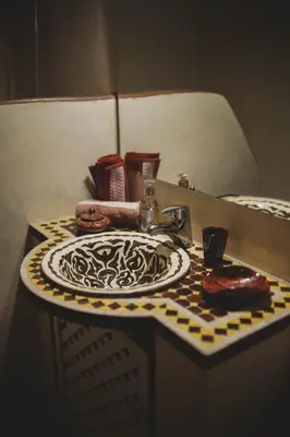 a bathroom sink with a plate on a table at Be Nomad in Marrakech