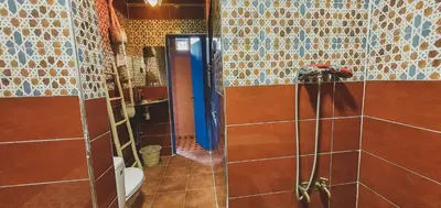 a bathroom with a shower stall and a toilet at Be Nomad in Marrakech