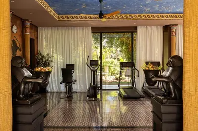 a lobby with a statue of two monkeys in a room at Palais Ronsard Relais & Chateaux in Marrakech