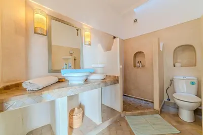 a bathroom with a sink and a toilet at Riad Ayla avec Piscine Privée in Marrakech