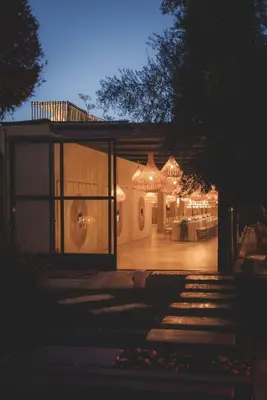 a house with a lit up patio at night at Villa Taj Marrakech in Marrakech