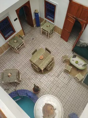 an overhead view of a room with a table and chairs at Riad Bab Lakhmiss in Marrakech
