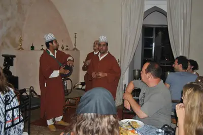 a group of men standing in a room with people at Riad dar Ourika & SPA in Marrakech