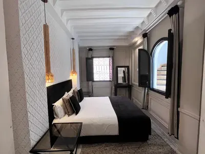 a bedroom with a large bed and a window at Riad Al Rimal & Spa in Marrakech