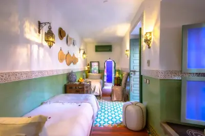 a bedroom with two beds in a room at Riad Kaiss By Anika in Marrakech