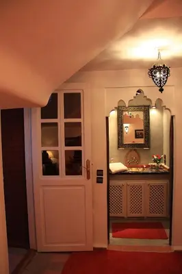 a hallway with a door and a mirror at Riad Eden in Marrakech